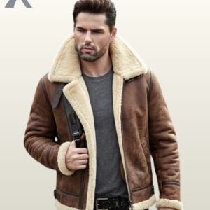 A close-up shot of a man modeling a vintage brown sheepskin shearling jacket featuring double buckle collar straps.