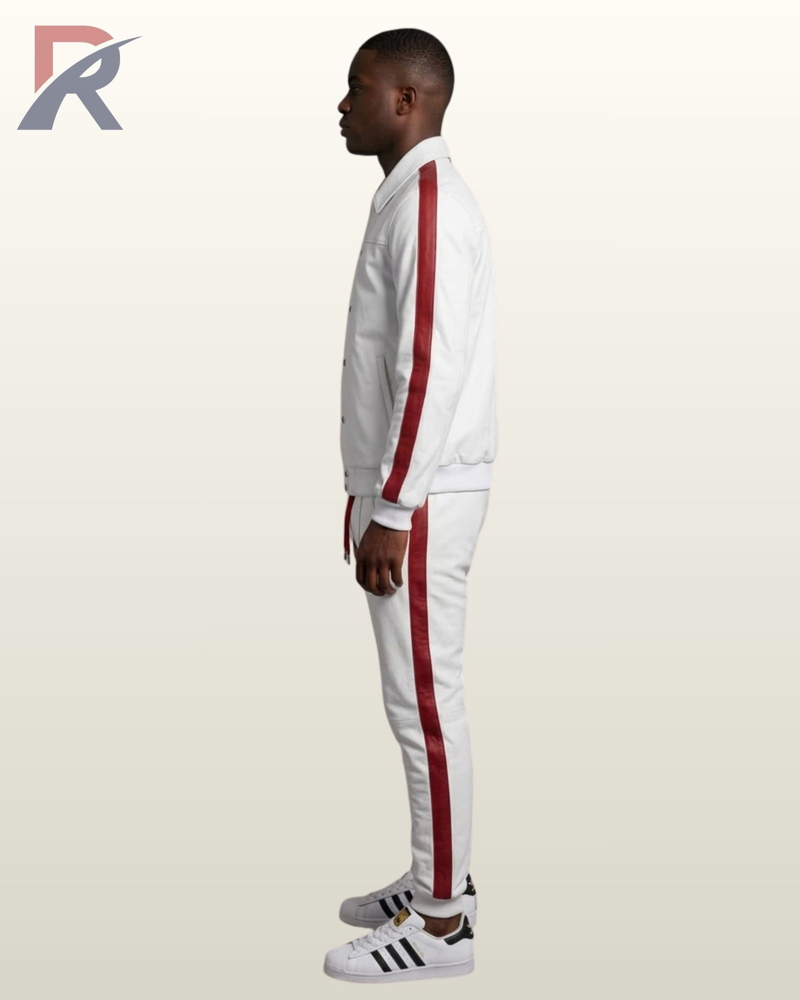 A model showcasing a high-end white athleisure jogger set featuring a structured jacket and slim-fit sweatpants with red side panels.
