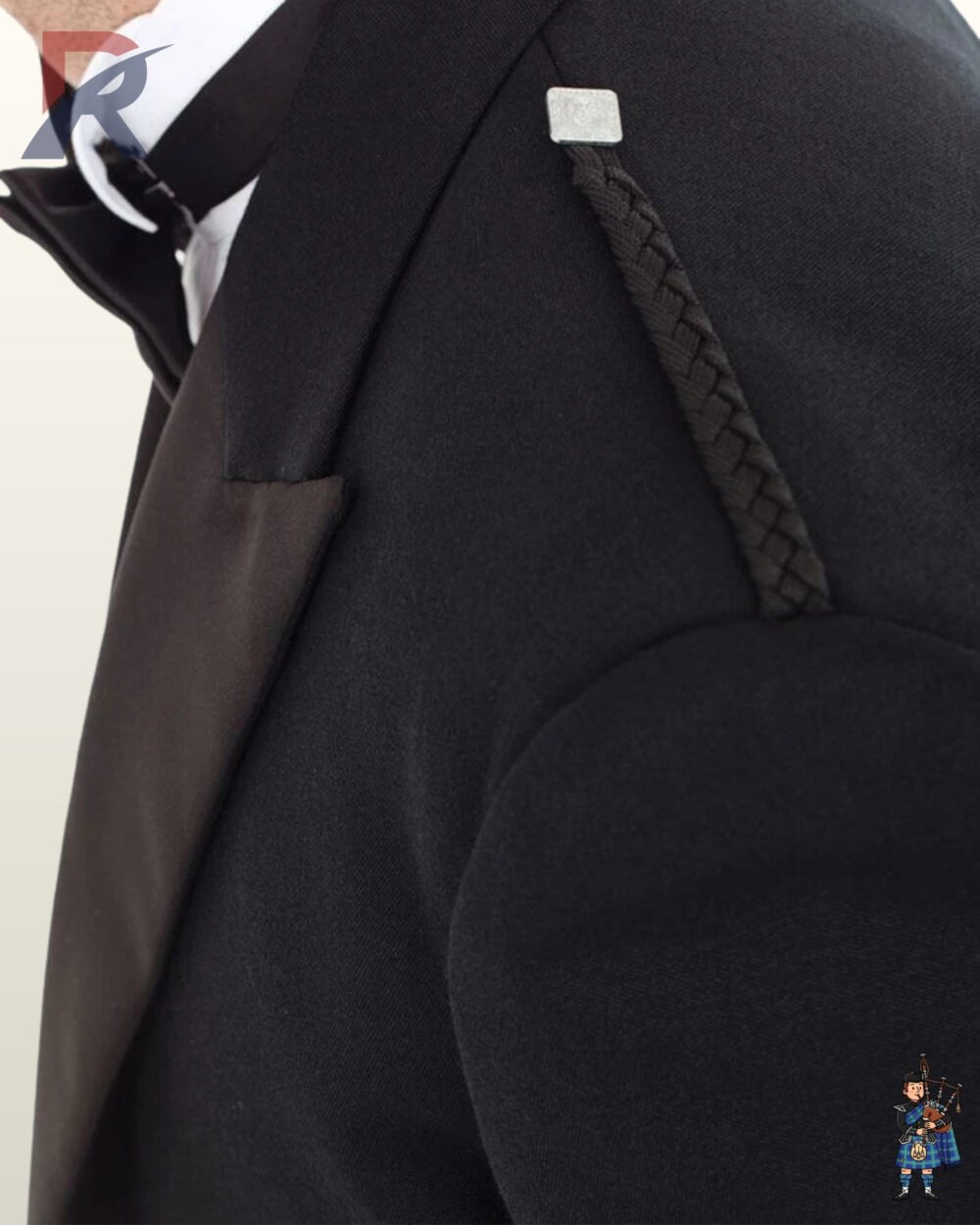Close-up view of a men's black Prince Charlie kilt jacket shoulder showing black braided epaulet cords and satin lapels.