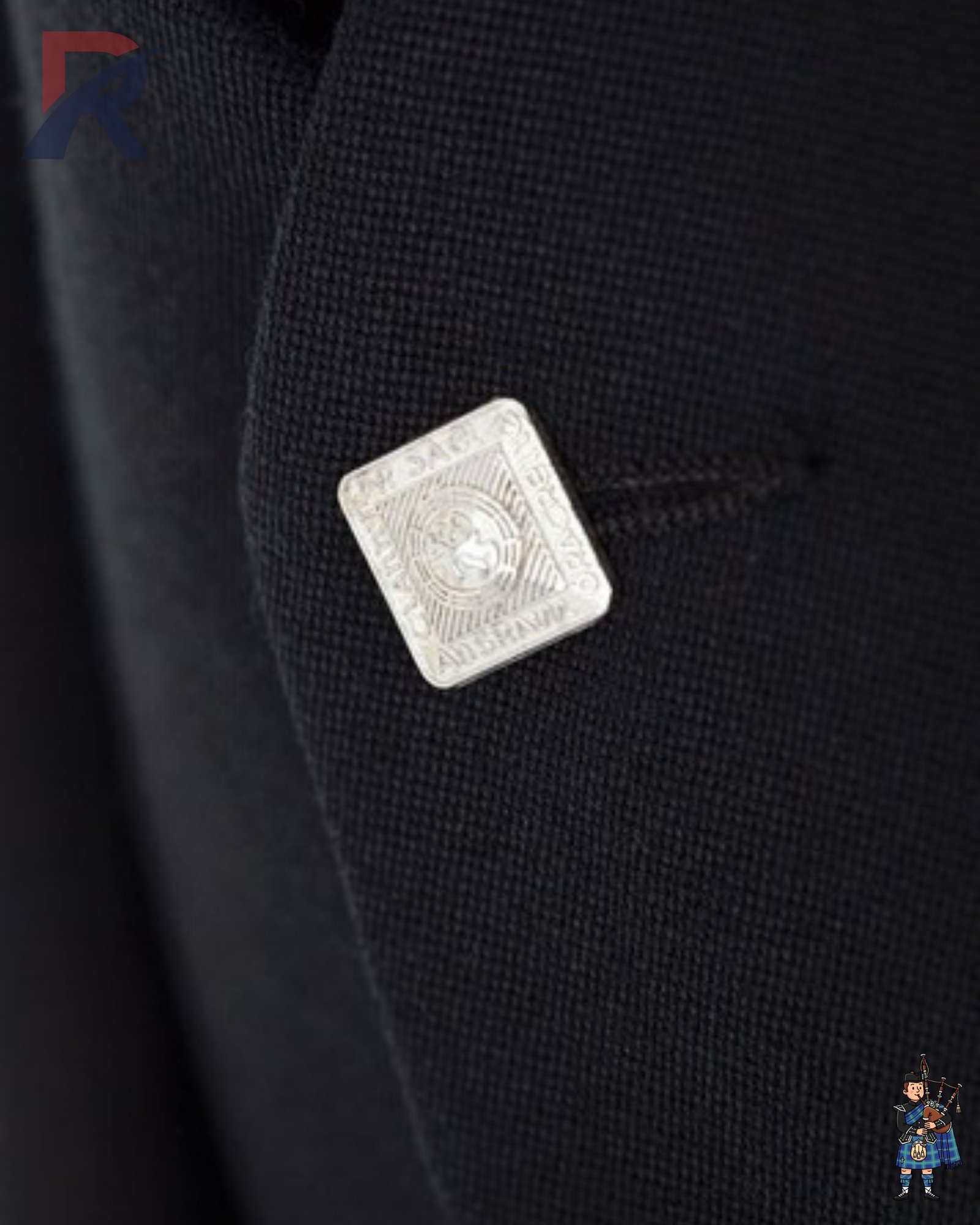 Detailed view of a traditional Scottish silver square button with ornate design on a black Argyle kilt jacket.