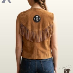Rear view of a model wearing a tan suede leather western vest with a curved fringed back yoke and a central black and white beaded rosette medallion.