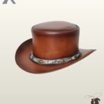 Three-quarter angled view of a cognac brown leather steampunk top hat featuring a python snakeskin hatband embellished with antiqued brass conchos.