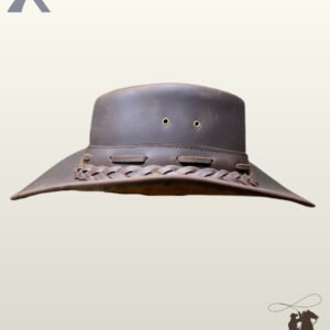 Handcrafted rustic dark brown leather cowboy hat displaying side air eyelets, a teardrop crown, and a woven leather band threaded through side loops.
