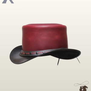 Side profile view of a two-tone steampunk top hat displaying its rich crimson crown, curved black brim, and studded leather hatband.