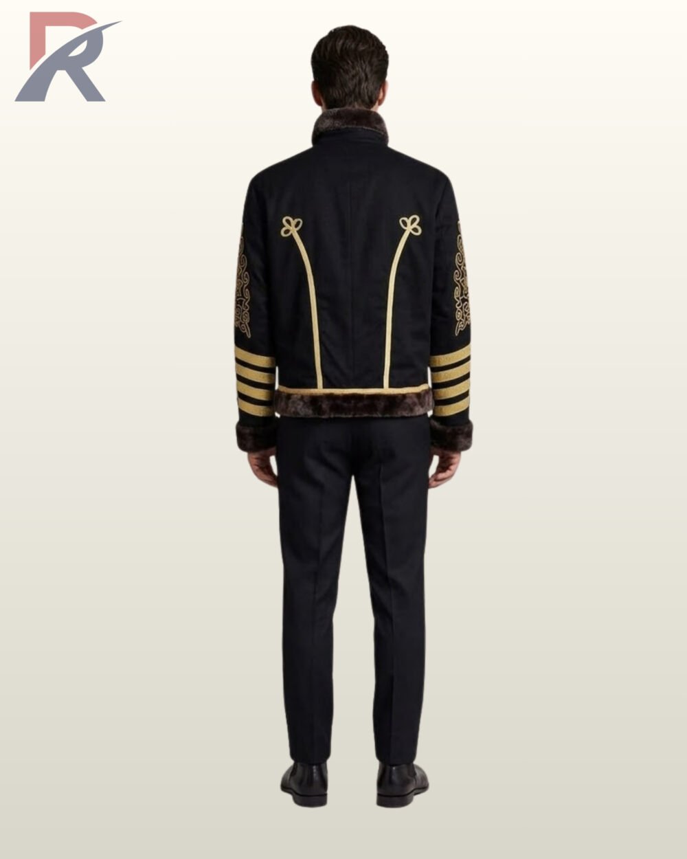 Full rear view of a model wearing a men's black military hussar jacket featuring dark fur collar trim, gold piping with trefoil loops, and gold sleeve stripes.
