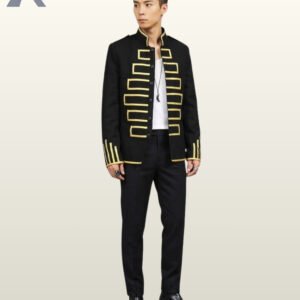 Full-length front view of a model wearing an open black military hussar jacket styled with black trousers, displaying gold chest braid motifs and cuff trim.