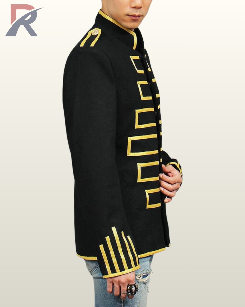 Close-up shot of a men's black mandarin collar parade jacket highlighting gold chest trim, shoulder epaulette, and detailed cuff striping.