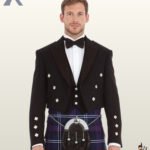 Full front view of a man wearing a formal black Prince Charlie kilt jacket set with a matching 3-button vest and purple tartan kilt.