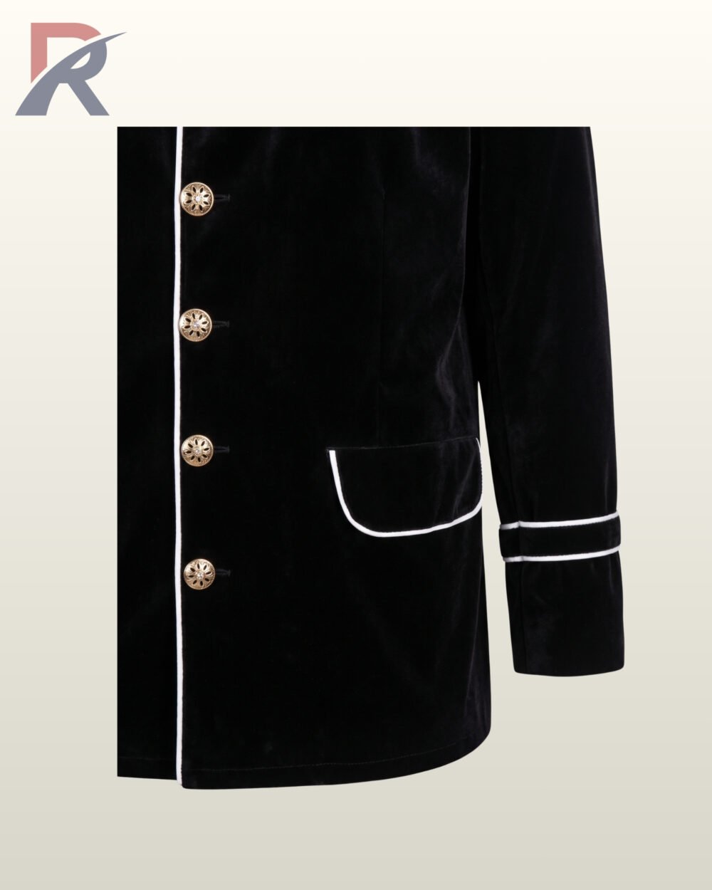 Close-up front product view of a men's black velvet military jacket showing white contrast piping edges, filigree brass buttons, flap pockets, and double sleeve braid.