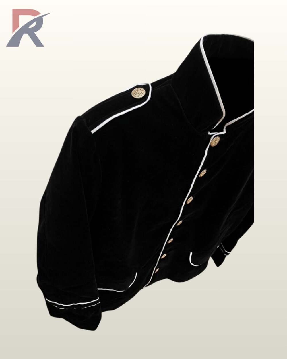 Angled top-down detail shot of a men's black velvet military officer jacket highlighting the standing collar, white contrast piping, and buttoned shoulder epaulet.
