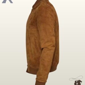 Side profile view of a men's camel tan suede leather bomber jacket featuring ribbed knit cuffs and waist hem.