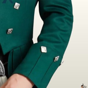 Close-up view of a men's emerald green wool Prince Charlie kilt jacket sleeve showing gauntlet cuffs and square silver buttons.