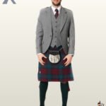 Full-length front view of a man wearing a complete light grey wool tweed Argyle kilt jacket and vest outfit set with a tartan kilt.