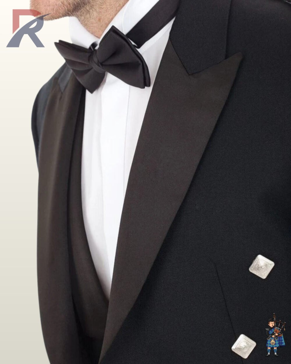 Close-up view of a men's black Prince Charlie jacket featuring black satin peak lapels, bow tie, and square silver buttons.