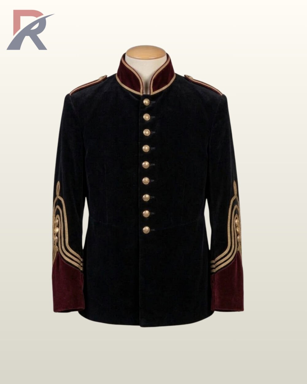 Flat display of a men's victorian gothic parade tunic jacket in plush black velvet with maroon velvet cuffs and ornate gold sleeve braid loops.