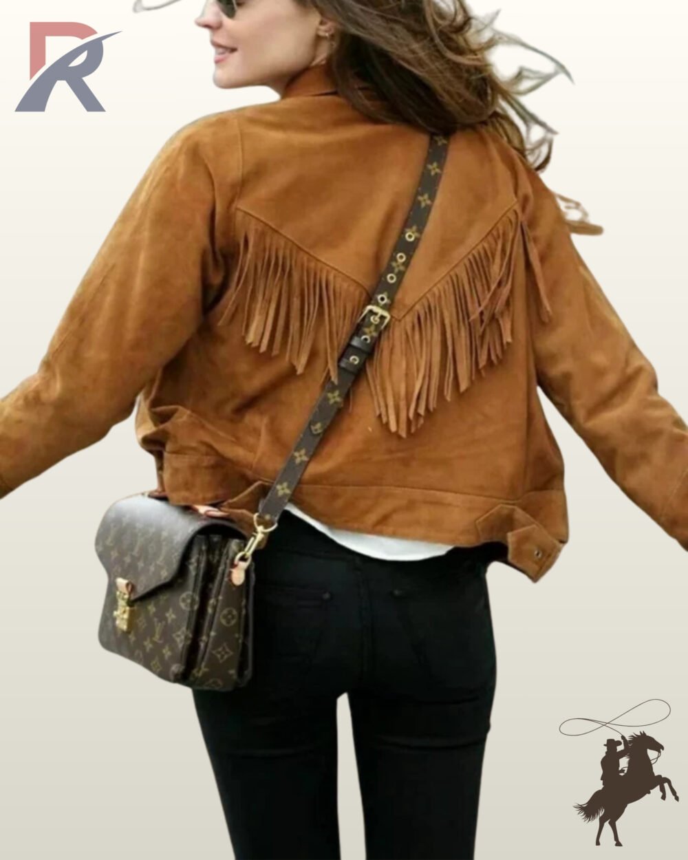 Rear view of a model wearing a women's camel brown suede western jacket featuring a V-shaped fringed back yoke and black pants.