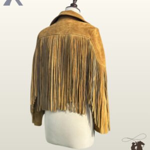 Back profile of a women's mustard yellow suede cowgirl coat featuring full back yoke fringe, sleeve tassels, and fold-over collar.
