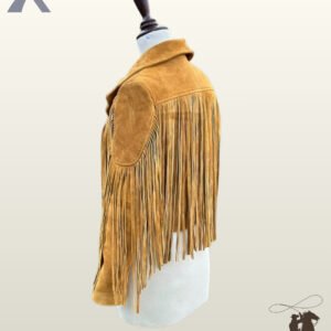 Side profile view of a women's mustard yellow suede western jacket on a dress form showcasing oval shoulder patches and long sleeve fringe.