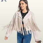 Dynamic action shot of a model wearing a women's beige suede cropped western jacket with flowing fringe details.