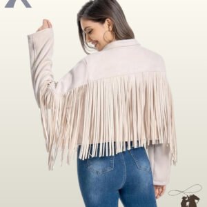 Rear view of a model wearing a women's beige suede cropped western jacket with long back yoke fringe trim and high-waisted blue jeans.