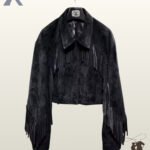 Front view of a women's cropped black suede western jacket with chest fringe, classic shirt collar, and sleeve tassels.