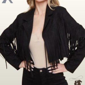 Front view of a model wearing an open cropped black suede western fringe jacket paired with a beige top and black jeans.