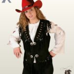 Women's native western style black suede vest styled over a white blouse and red cowboy hat, showcasing chest fringe and silver conchos.