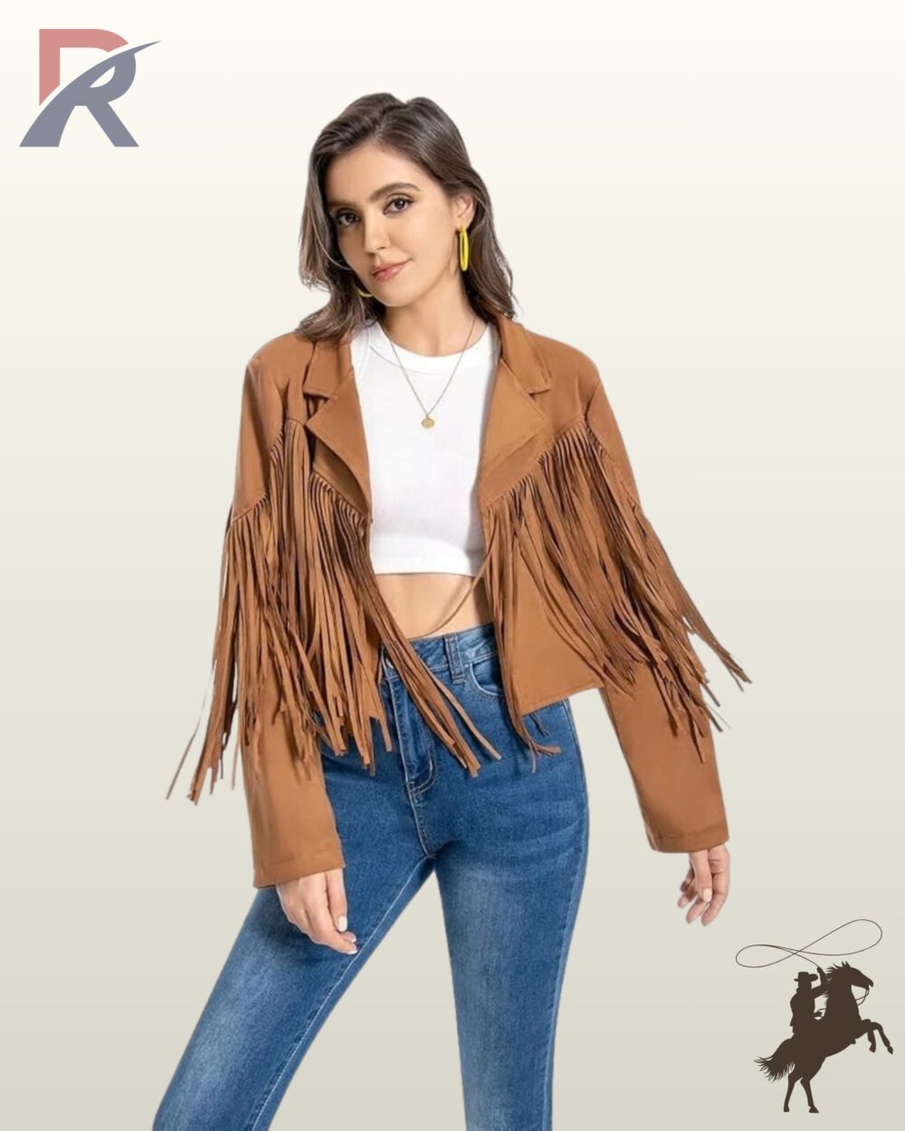 Front view of a smiling model wearing an open camel tan suede western fringe jacket styled over a white crop top and blue jeans.