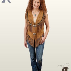 Front full-length view of a model wearing a cognac tan suede western fringe vest featuring silver concho ties, turquoise bead accents, and bone pipe details.