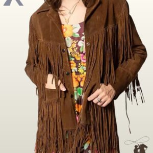 Front view of a model wearing an open dark brown suede longline western fringe jacket layered over a colorful floral print dress.