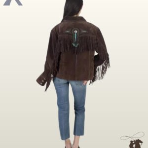 Rear view of a model wearing a women's dark brown suede western jacket with a fringed back yoke, central silver concho, turquoise bead tassel, and stud accents.
