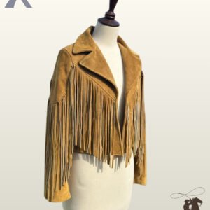 Angled front view of a open mustard tan suede cropped western jacket on a dress form mannequin showcasing wide lapels and chest fringe.
