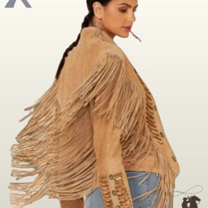 Side profile view of a model in a women's tan suede western fringe jacket showcasing flowing back fringe, bone pipe bead accents, and silver concho studs.