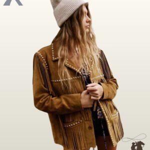Three-quarter view of a model wearing a women's tan suede western fringe jacket showcasing silver studded collar edges and pocket fringe.